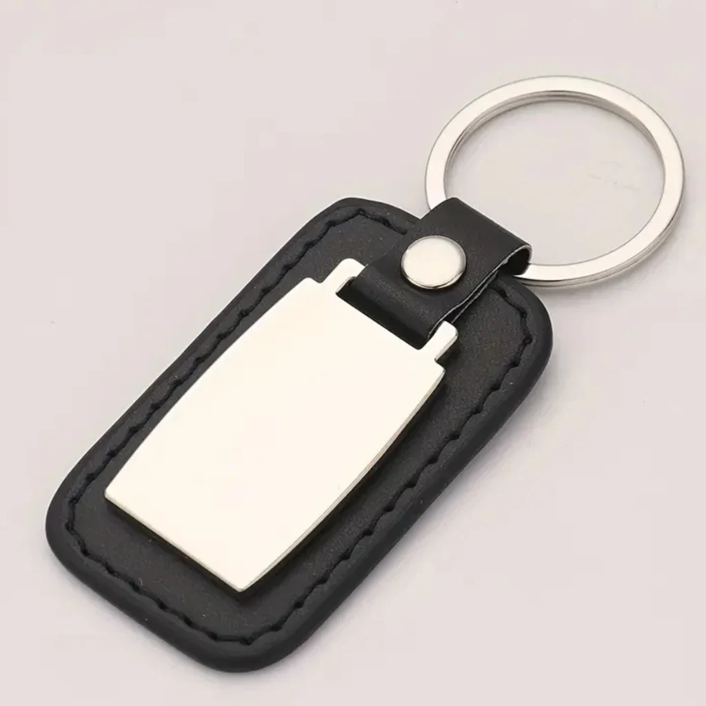 llaveros metálicos - cuero sintetico color negro